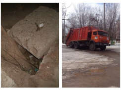 Мусоровоз провалился в яму и застрял у детского сада в Волгограде 