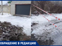 Волгоградка с машиной в гараже стала заложником огромной ямы: видео с места